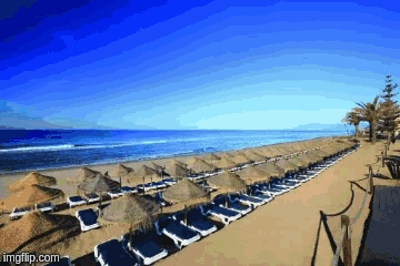 a beach with chairs and umbrellas and the words imgflip.com on the bottom right
