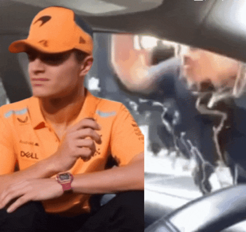 a man in an orange shirt that says dell on it