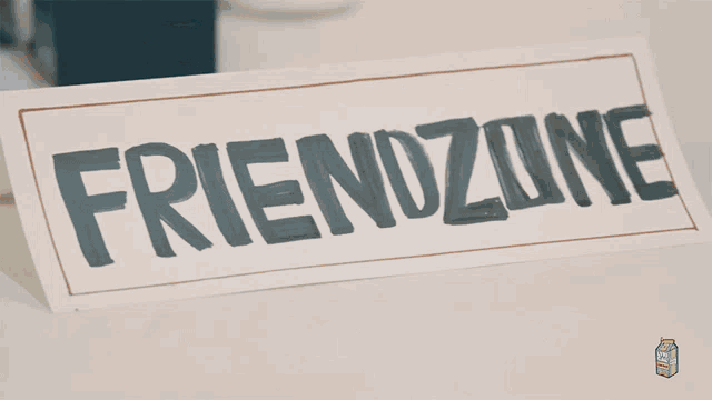 a table with a sign that says " friendzu "