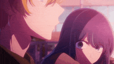 a man and a woman are looking at each other with purple hair