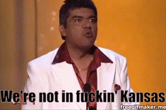 a man in a white suit is saying we 're not in fuckin ' kansas