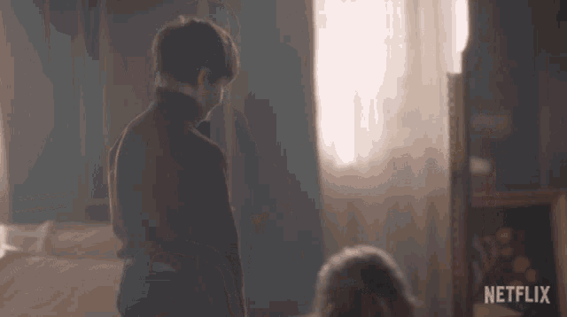 a blurred image of a person with a netflix logo in the bottom right corner