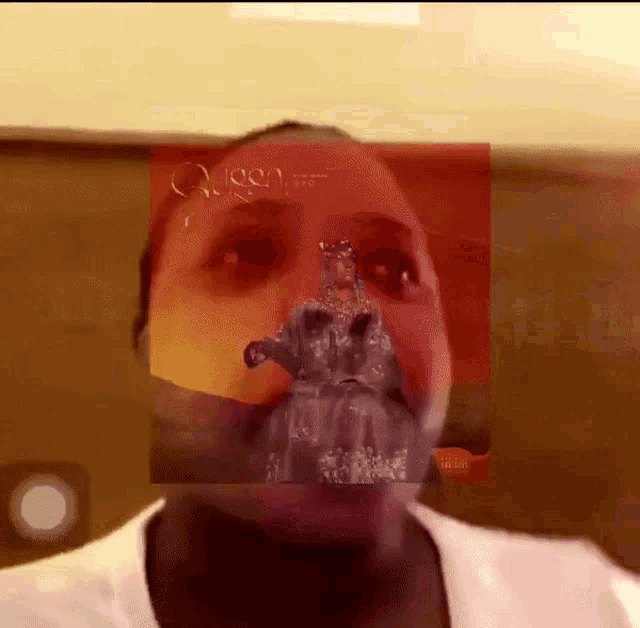 a man with a picture of a queen on his face