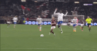 a soccer game is being played on a field that has a sign that says ' sky sports ' on it