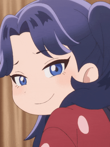 a close up of a girl 's face with blue hair