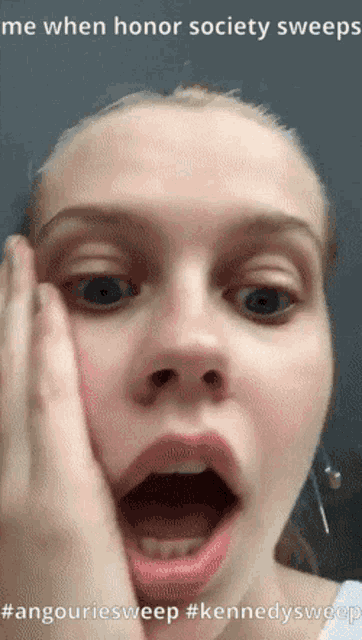 a woman is making a funny face with her mouth open