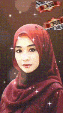 a woman wearing a red scarf and a hijab with the letter o on her head