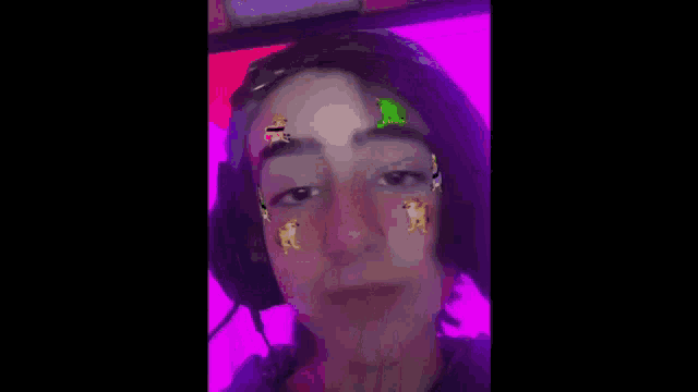 a close up of a person wearing headphones and a face mask .