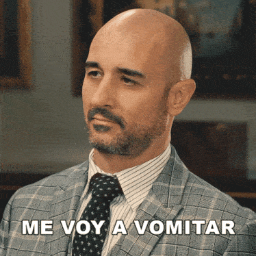 a man in a suit and tie has the words me voy a vomitar above his head