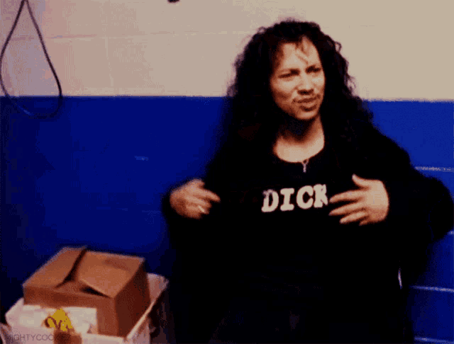 a woman is wearing a shirt that says dick