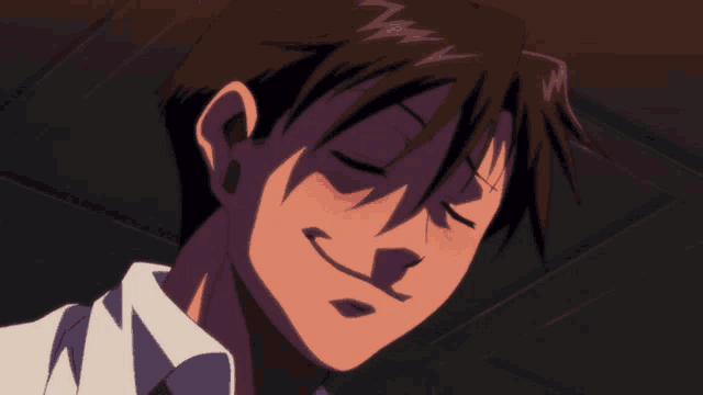 a close up of a man 's face with a smile on it