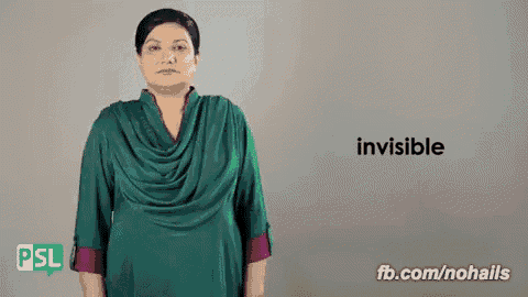 a woman wearing a green shirt says invisible in sign language