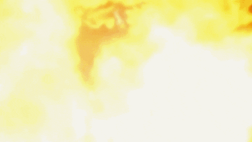 a close up of a person 's hand surrounded by fire
