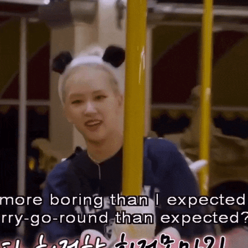 a girl wearing a headband with panda ears says more boring than i expected