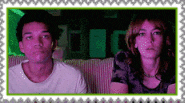 a man and a woman are sitting next to each other in a green frame