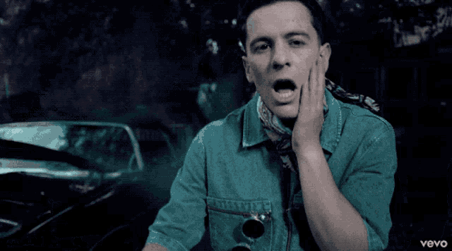 a close up of a man 's face with the word vevo in the lower right corner