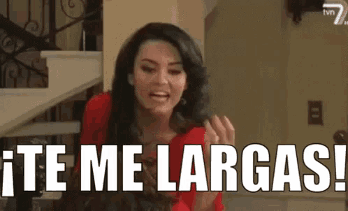 a woman in a red dress is standing in front of a staircase and saying `` te me largas '' .