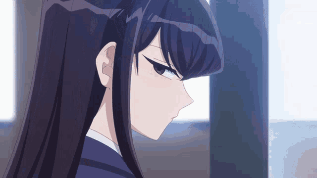 a close up of a girl 's face with long hair