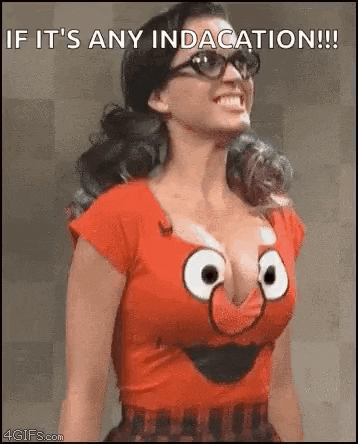a woman is wearing a red shirt with a cartoon face on it and glasses .
