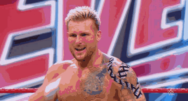 a pixelated image of a man in a wrestling ring with the word smackdown behind him