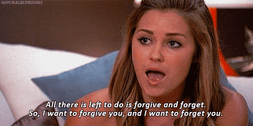 a woman is laying on a bed and saying " all there is left to do is forgive and forget "