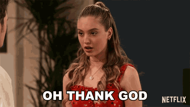 a woman in a red dress is saying oh thank god