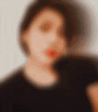 a blurry picture of a woman with red lipstick