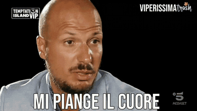 a bald man with a beard is on a tv show called temptation island vip