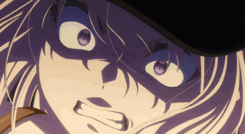 a close up of a person 's face with a hat on