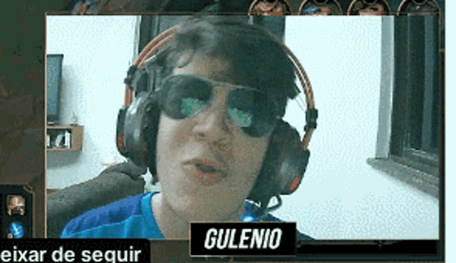 a man wearing headphones and sunglasses has the name gulenio on the bottom right