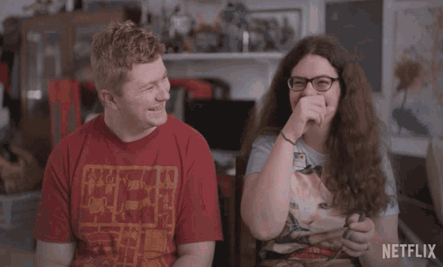 a man and a woman sitting next to each other with the words that 's very naughty