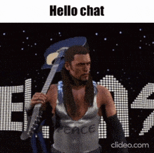 a man in a wrestling outfit is holding a guitar in front of a sign that says `` hello chat '' .