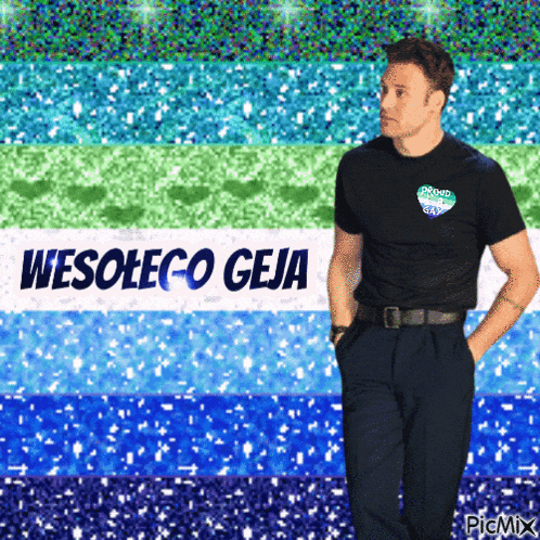 a man in a black shirt stands in front of a wesoleco geja sign