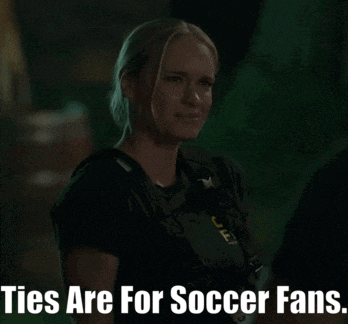 a woman in a black shirt with the words ties are for soccer fans below her