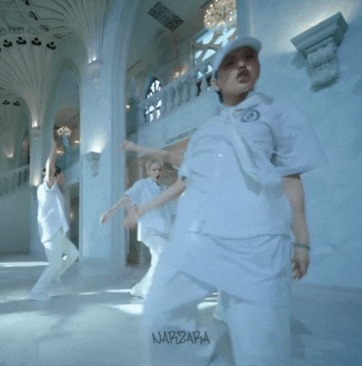 a woman in a white uniform is dancing in a hallway with the word napaza on the bottom