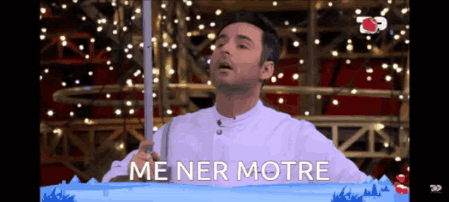 a man holding a pole with the words me ner motre on the bottom
