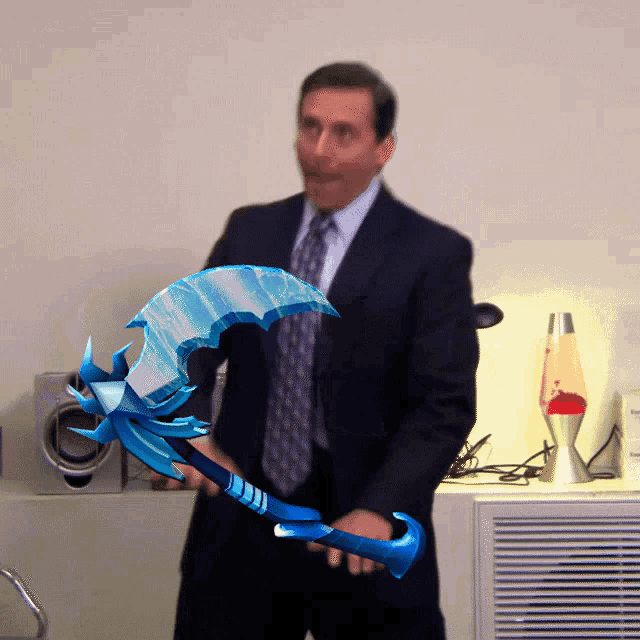 a man in a suit and tie is holding a blue sword