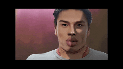 a close up of a man 's face with his tongue out