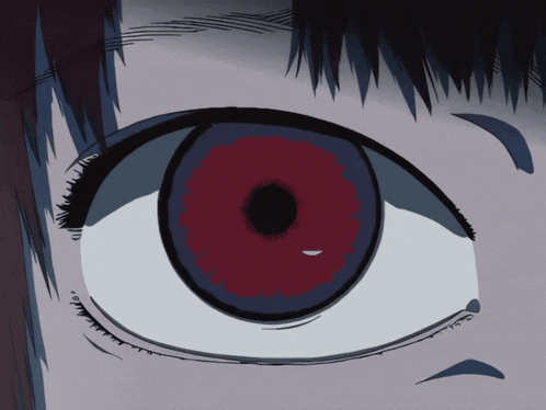 a close up of a person 's eye with red eyes