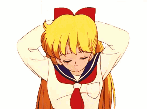 a girl in a sailor uniform is brushing her long hair