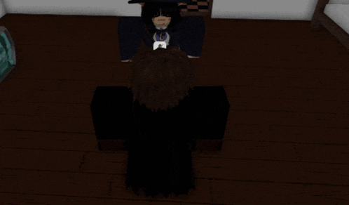 a girl in a witch costume is kneeling down next to a boy