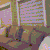 a blurred image of a person standing in front of a window with a purple background .