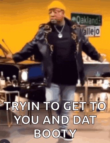 a man is dancing in a room with a sign that says oakland vallejo on it .