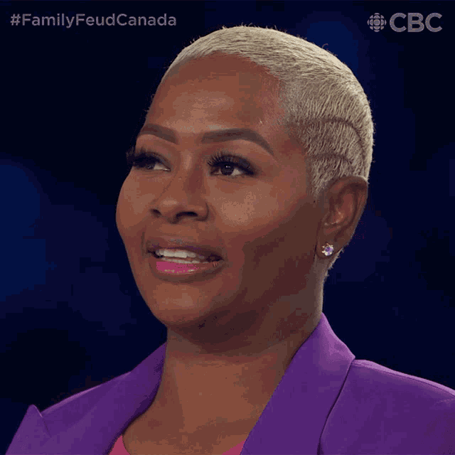 a close up of a woman 's face with #familyfeud canada written on the bottom