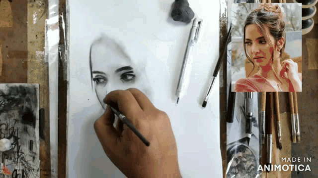 a person is drawing a woman 's face with a brush and the words made in animotica on the bottom