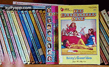 a book titled the babysitters club sits on a shelf
