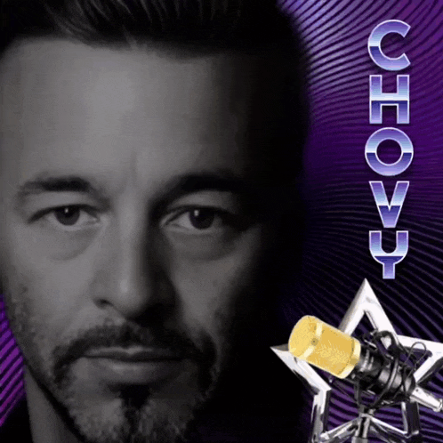 a man with a beard is standing in front of a microphone and the word chovy is visible
