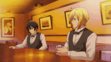 two men are sitting at a table in a restaurant