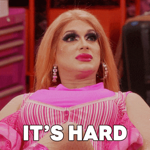 a drag queen says it 's hard while wearing a pink top