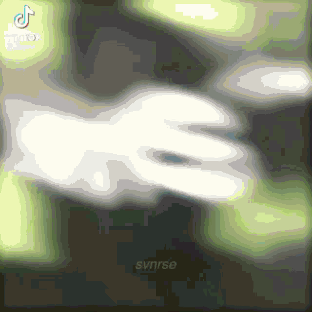 a blurred image of a person 's hand with the word synrse written below it